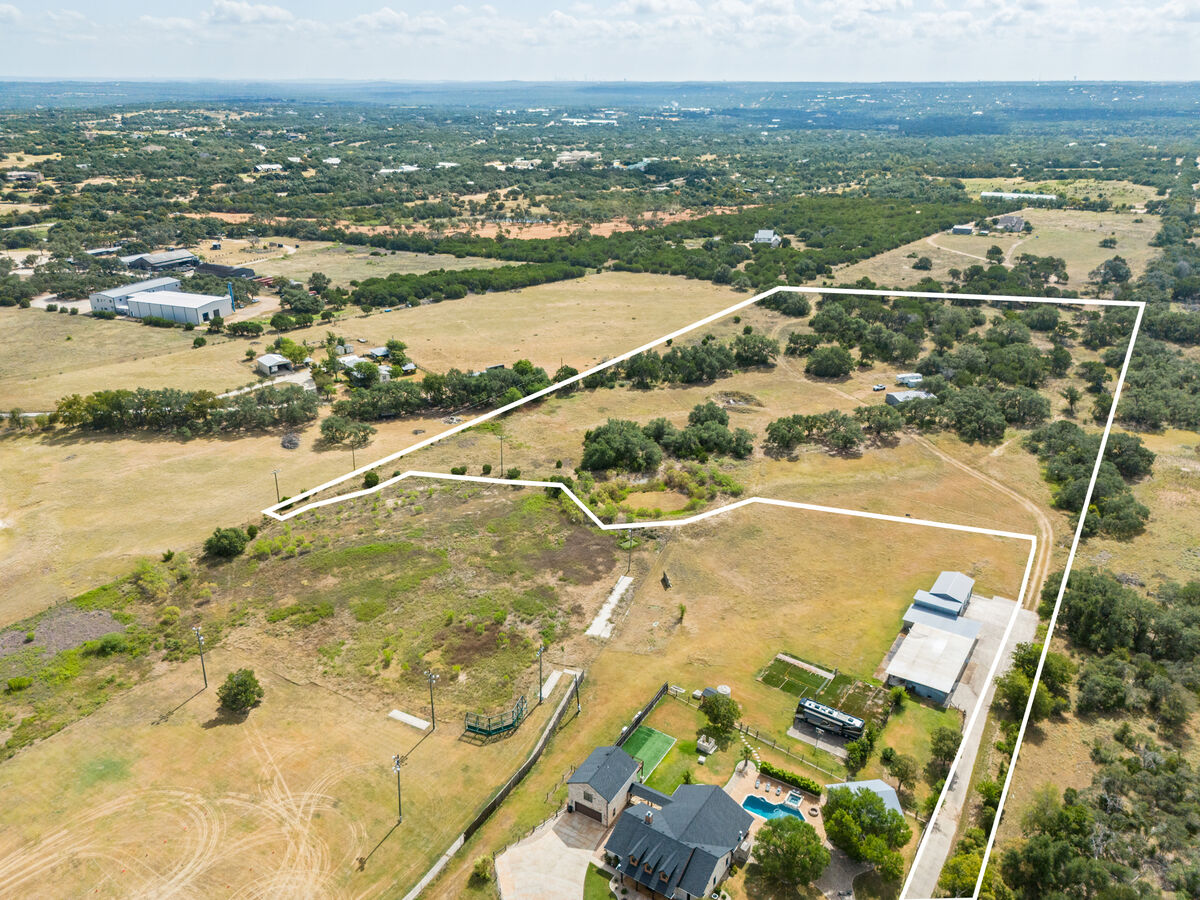 31301 Ranch Road 12, Dripping Springs TX — drone aerial of the 12.71-acre entitled boat & RV storage site, approximate boundary outlined